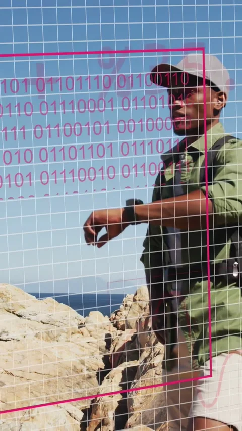 Vertical video: Man checking watch on cliff for route, sparking data HUD with Stock Footage 334128045