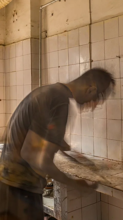 Vertical Video: A man cleans cleaning old house, home renovation project. Stockbeeldmateriaal 340540843