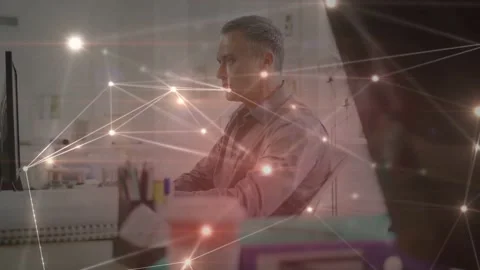 Vertical video: Man clicking mouse at desk causing nodes or links moving over Stock Footage 333670659