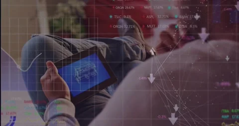 Vertical video: Man on couch tapping tablet, analyzing schematic while tech data Stock Footage 331832894