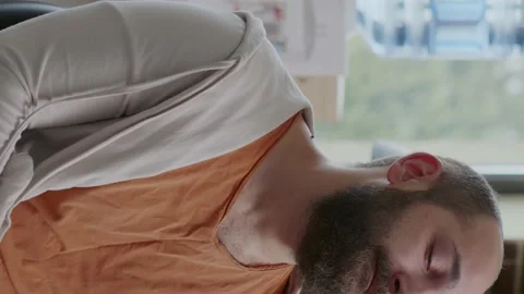 Vertical video: Man crying in front of psychologist because of addiction and Stock Footage 170882663