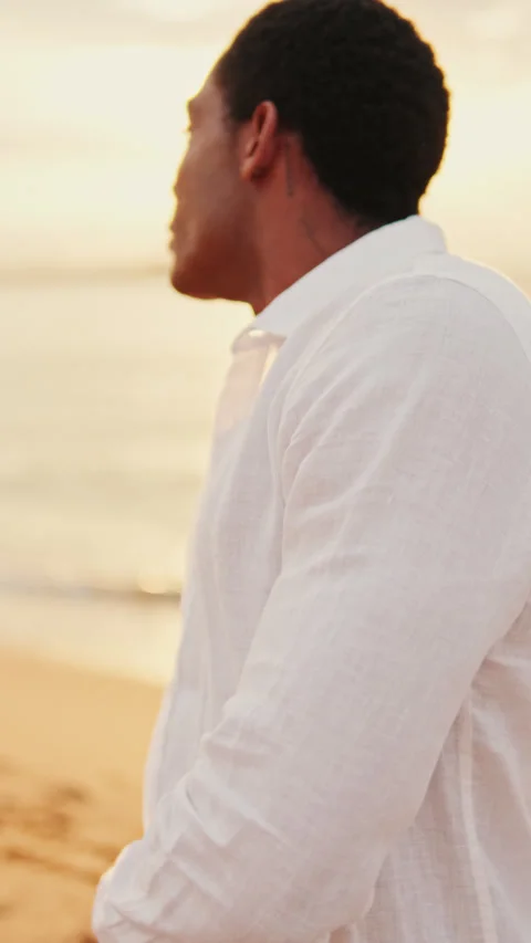 Vertical video, Man Dancing on the Beach at Sunrise Stock Footage 317567509