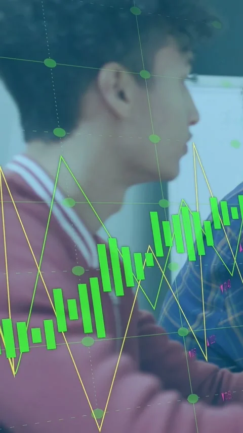 Vertical video: Man at desk leaning, talking; data update driving green bars, Stock Footage 333480157