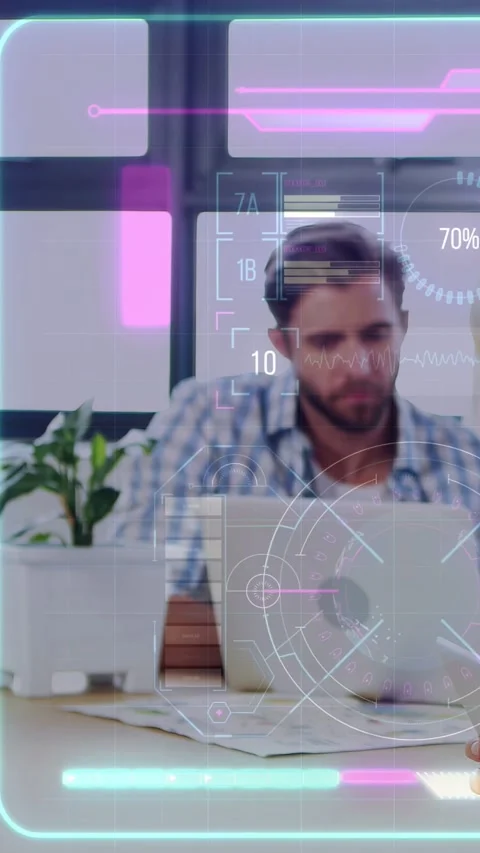 Vertical video: Man at desk tapping laptop, initiating AR HUD updating tech Stock Footage 333212560