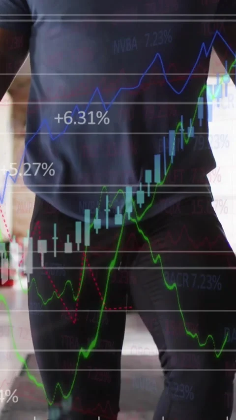 Vertical video: Man doing high knees step raising camera, market charts Stock Footage 330769773
