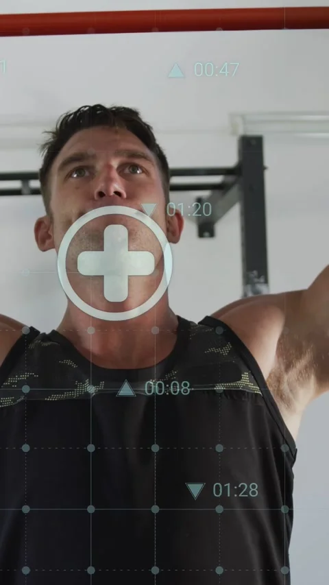 Vertical video: Man doing steady pullups on red bar as HUD timer hits zero, Stock Footage 333611018