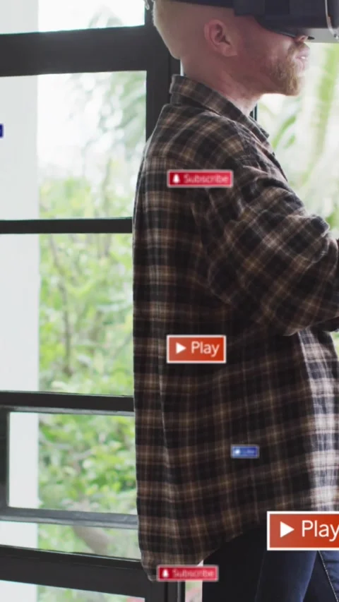 Vertical video: Man donning VR headset using UI for tech demo Play Subscribe Stock Footage 334319206