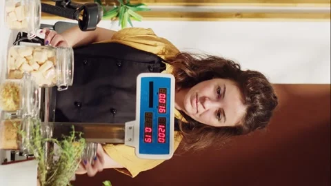 Vertical video Man at eco friendly supermarket checkout Stock Footage 253521978