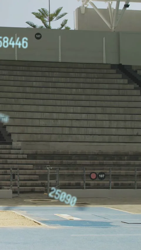 Vertical video: Man entering sprinting track hitting board leaping while AR nums Stock Footage 333596003