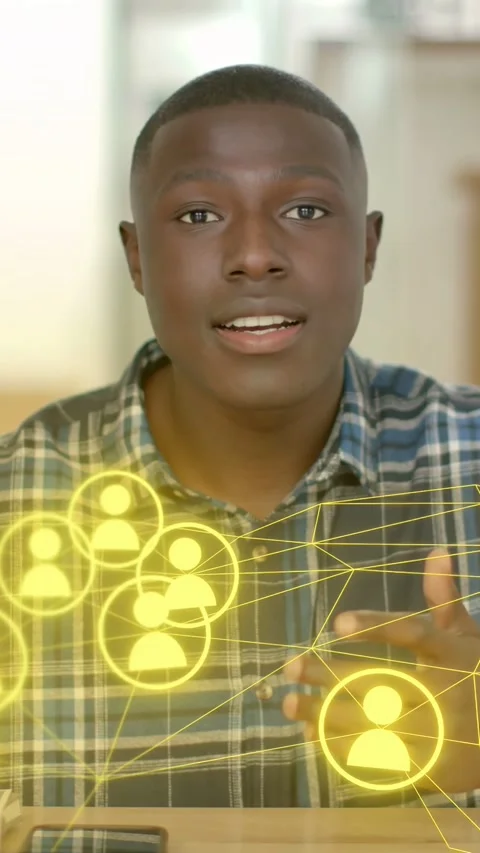 Vertical video: Man explaining networking, gesturing to phone and initiating Stock Footage 333978102