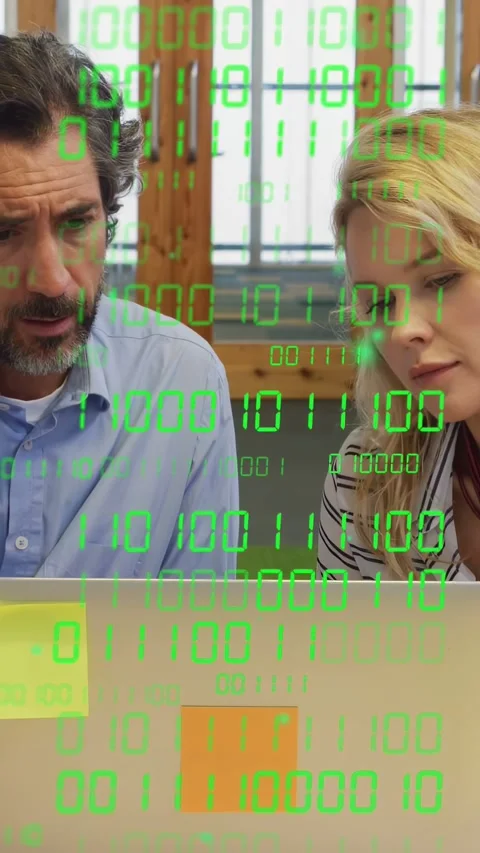 Vertical video: Man explaining, woman reading laptop, code overlay appearing, Stock Footage 334378400