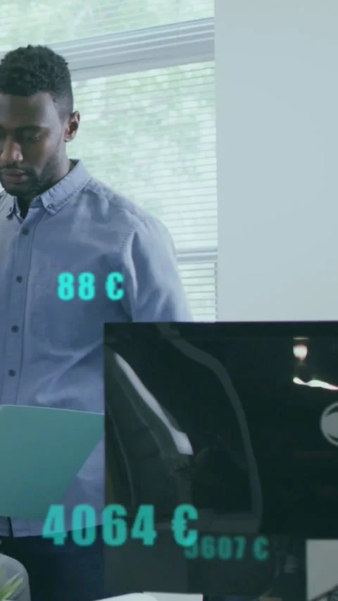 Vertical video: Man flipping teal folder in business, causing turquoise data Stock Footage 334318989