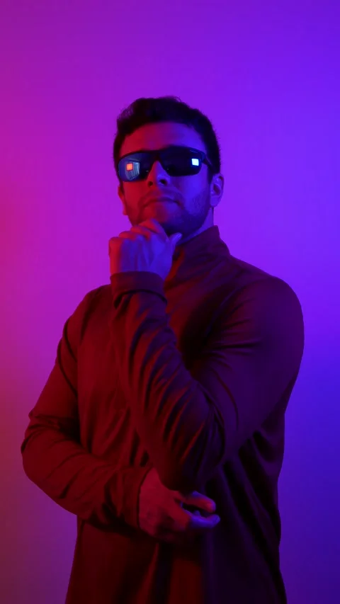 Vertical video. Man of the future, with purple and blue lighting, with blue.. Stock Footage 236799715
