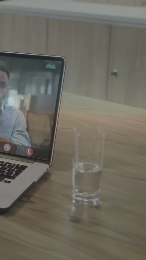 Vertical video: Man gesturing on laptop sparking UI sliding right casting code Stock Footage 334317907