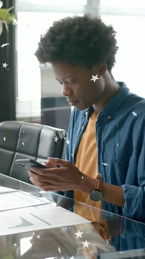 Vertical video: Man glass table scanning phone calling, stars highlighting glass Stock Footage 333745247