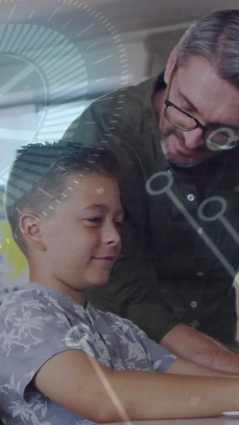 Vertical video: Man with glasses guiding boy in patterned shirt at school after Stock Footage 331337192