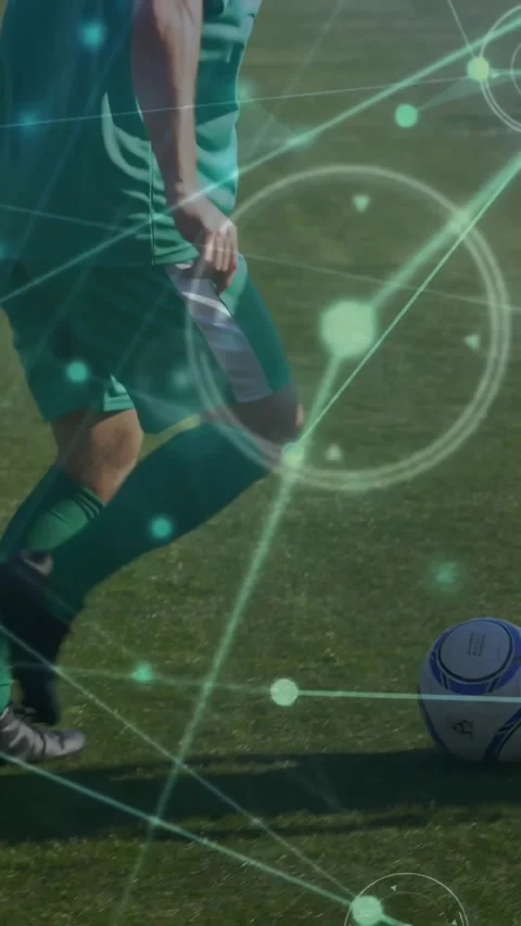 Vertical video: Man in green nudging ball on line holding control while HUD Video stock 331291683