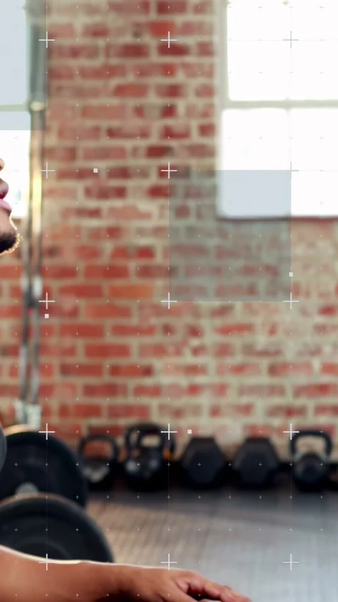 Vertical video: Man gripping dumbbell, performing bent-over rows to build back Video stock 328398570