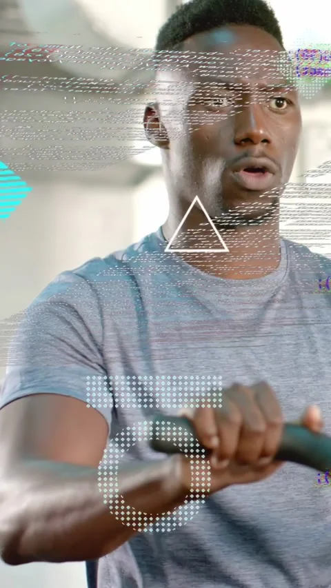 Vertical video: Man gripping handles, training in gym, code icons rising, Stock Footage 333259656
