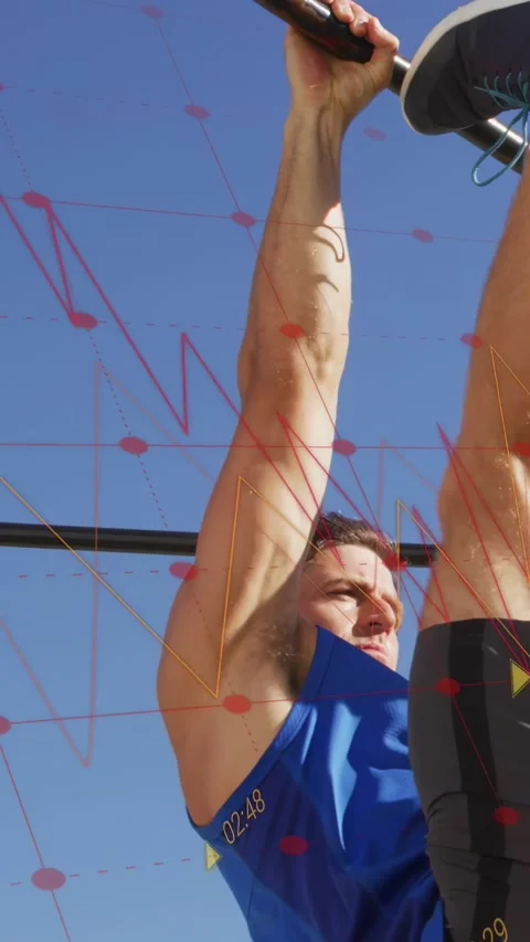 Vertical video: Man gripping pull-up bar and raising legs for fitness, red Stock Footage 333603695