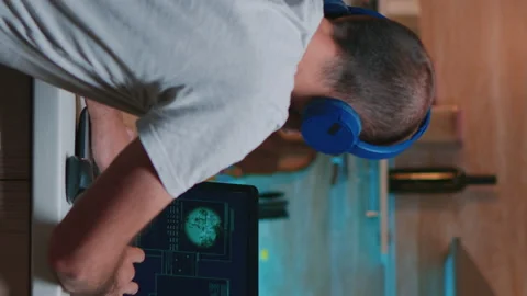 Vertical video Man hacker coding html and programming on screen laptop Stock Footage 142937659