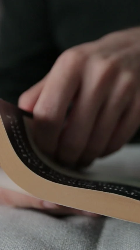 Vertical video. Man hand turning pages of a book, close up. Stock Footage 343763114
