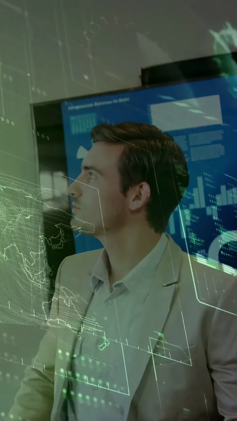 Vertical video: Man hearing off cue, turning and pausing, studying tech charts 動画素材 331274431