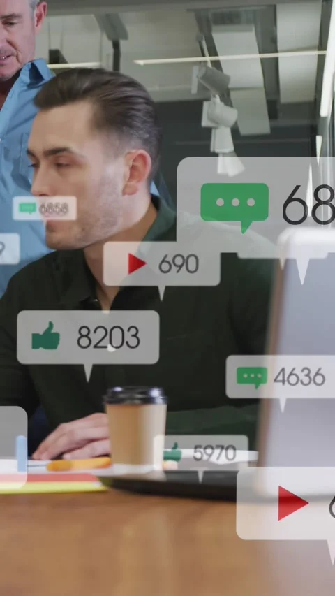 Vertical video: Man hearing senior while bubbles from laptop drifting across Stock Footage 332687490