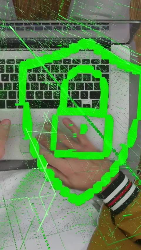 Vertical video: Man holding device above laptop at desk, causing green tech Stock Footage 334792780