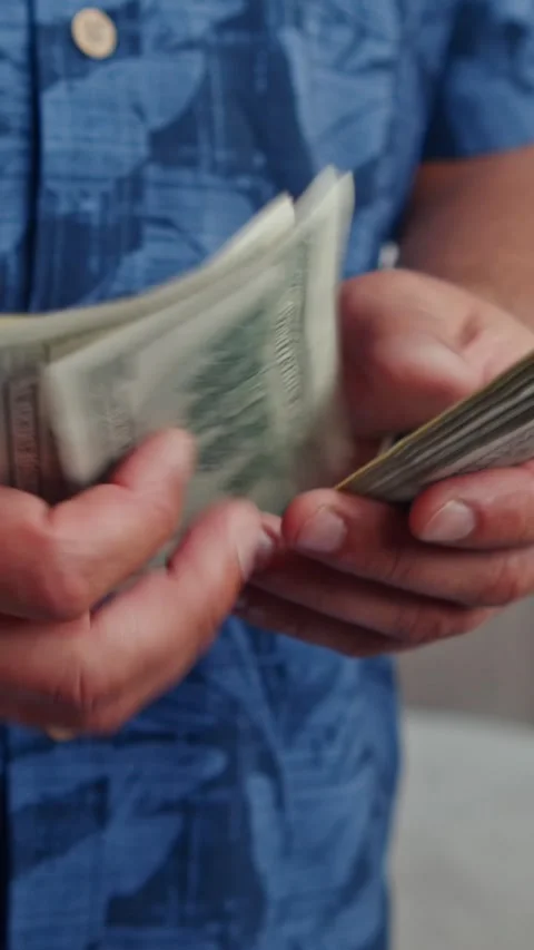 Vertical Video Man Holding Stack Bills For Budgeting, Payment Personal Savings Video stock 315689026