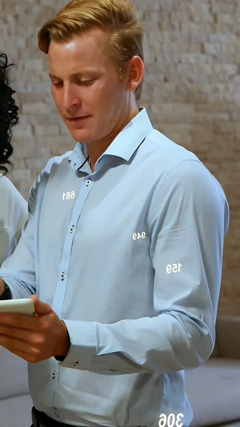 Vertical video: Man holding tablet reading screen and sharing tech math symbols Video stock 333596431