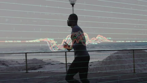 Vertical video: Man jogging seafront, first step starting waveform grid over Stock Footage 331048053