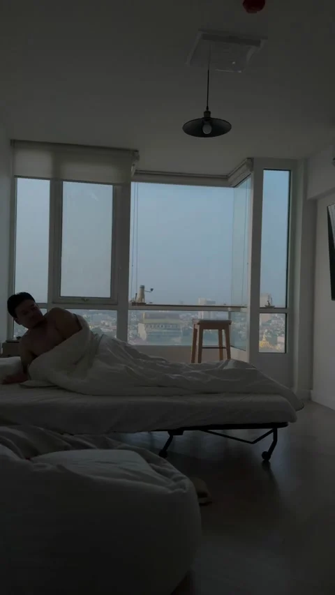 Vertical video, Man just wake up in the morning living in his apartment. Stock Footage 272290901