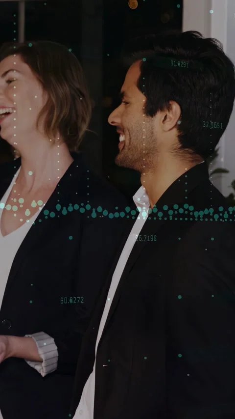 Vertical video: Man laughing, responding to comment during business, teal Stock Footage 332775449