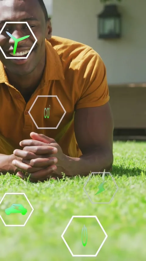 Vertical video: Man on lawn while camera revealing icons CO2, wind overlaying Stock Footage 333542086