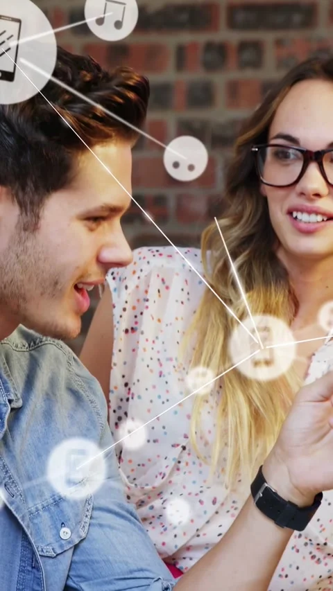 Vertical video: Man leaning in and speaking, woman smiling, node icons linking Video stock 333487456