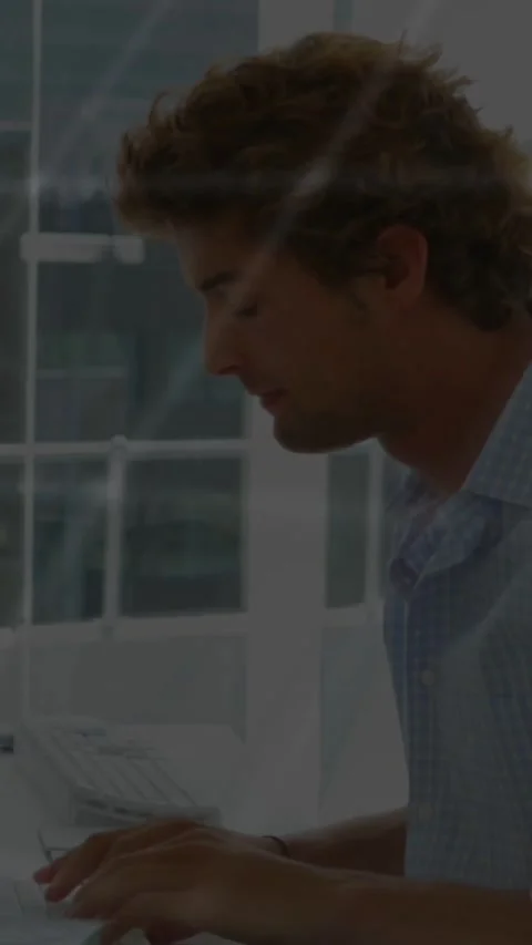 Vertical video: Man leaning to desk, dot map and console text animating, Stock Footage 331337206