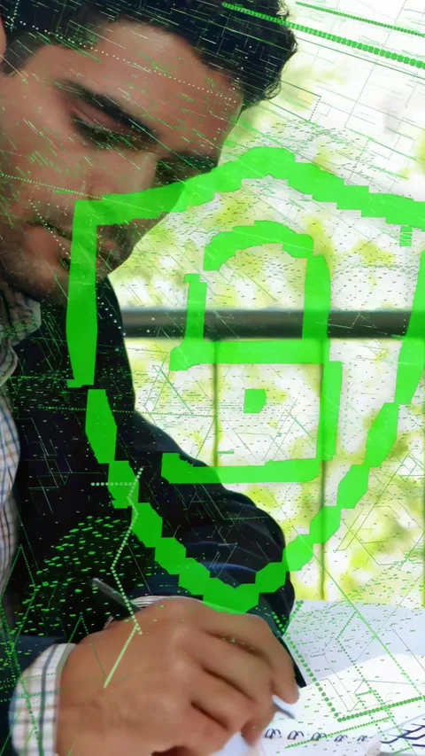 Vertical video: Man leaning forward writing notebook for tech, neon lock shield Stock Footage 333953302
