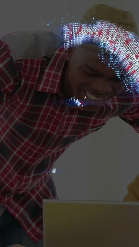 Vertical video: Man leaning over laptop and shaping 3D point-cloud with hands Stock Footage 331271106