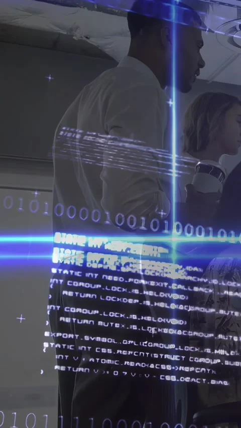 Vertical video: Man leaning toward screen and woman with cup checking code as Stock Footage 331047371