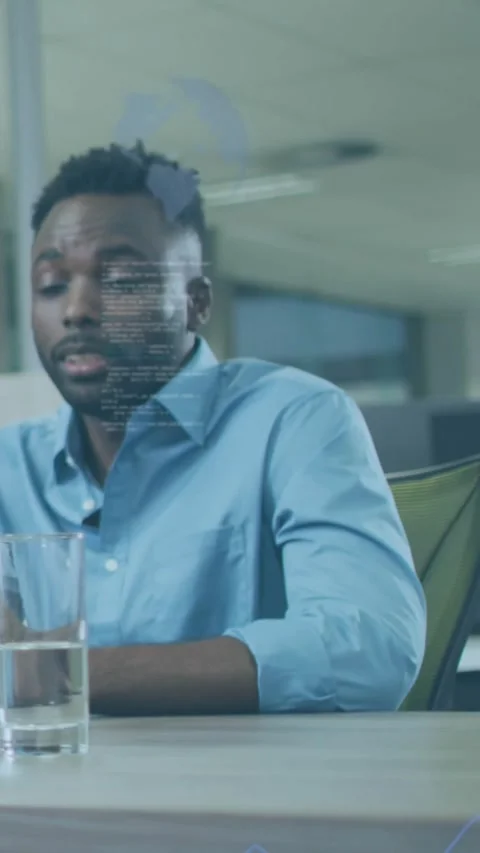 Vertical video: Man leaning toward HUD appearing, analyzing code overlays for Stock Footage 334187428