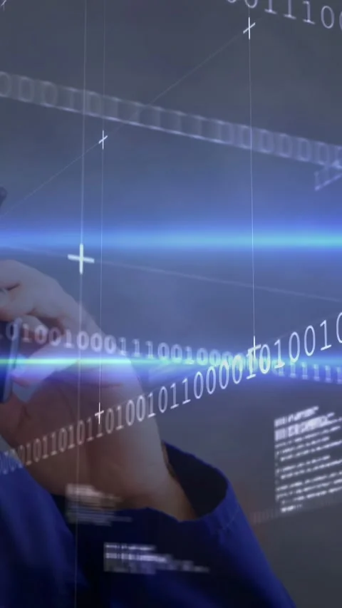 Vertical video: Man lifting cell to ear speaking on tech call while code overlay Stock Footage 332957454