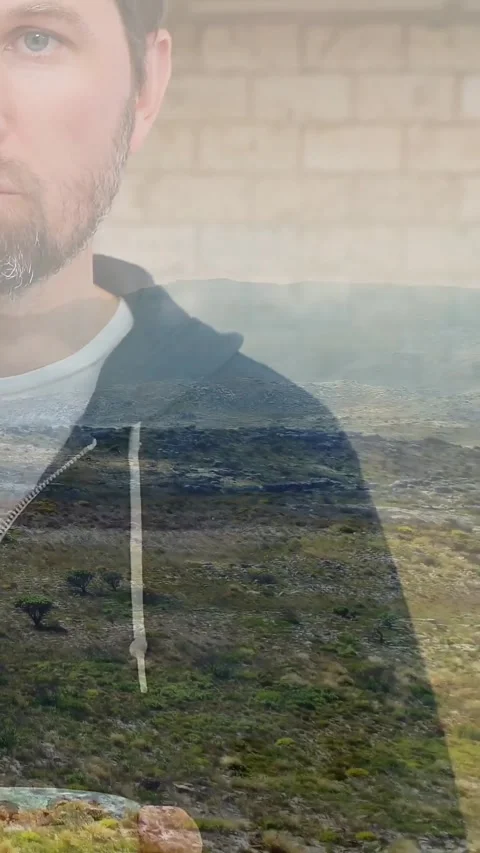 Vertical video: Man lifting green mug starting shore overlay rising over face, Stock Footage 331720925