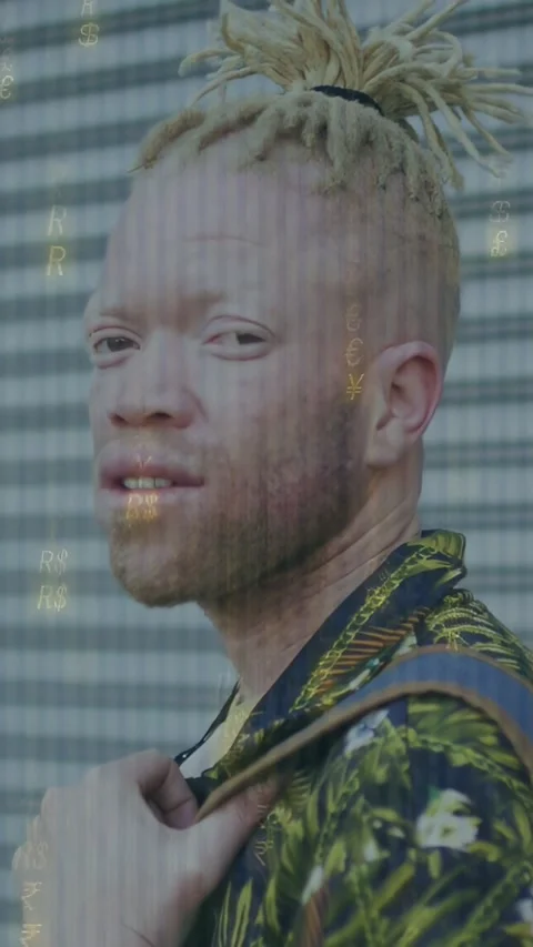 Vertical video: Man looking on cue, turning, holding strap, gold glints on face Stock Footage 334386795