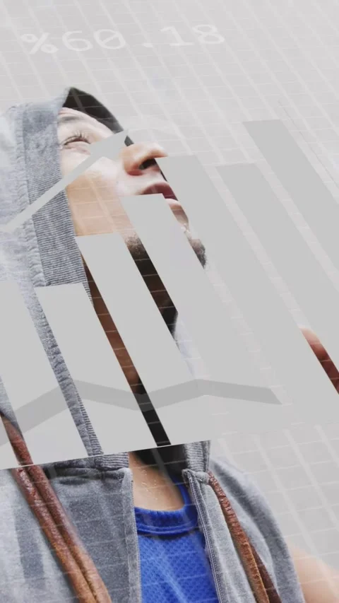 Vertical video: Man looking up as HUD charts appear, tilting head and reaching Stock Footage 333745405