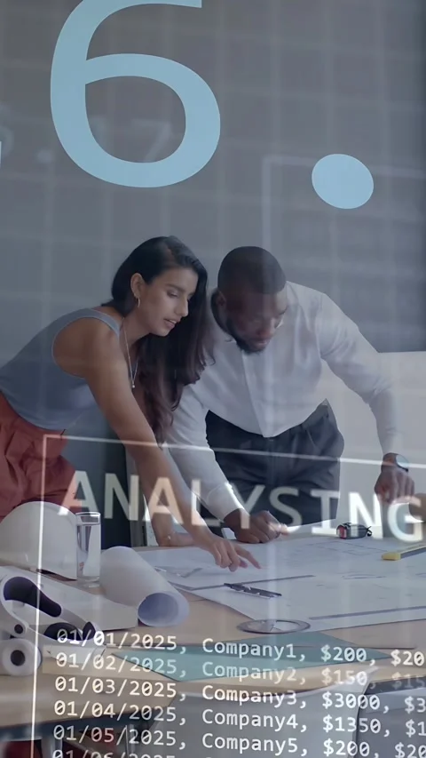 Vertical video: Man marking plans, woman pointing at plans, causing data charts Stock Footage 334792438