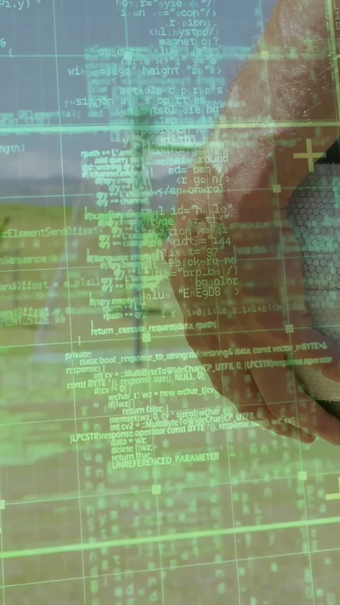 Vertical video: Man moving right hand by seaside activating tech HUD code and Stock Footage 329934693