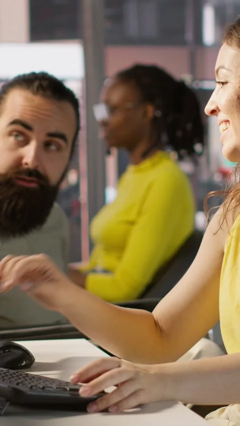 Vertical video Man with paraplegia drinking coffee, checking progress done by Stock Footage 319475724