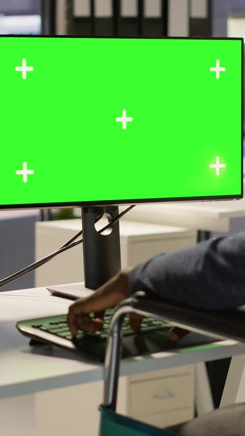 Vertical video Man with paraplegia optimizing company software with mockup Stock Footage 319472987