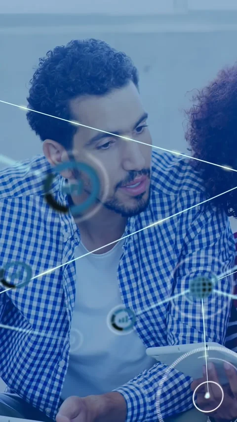 Vertical video: Man with partner tapping tablet, causing network nodes overlay, Stock Footage 334317629